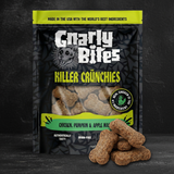 Bag of Charly Bites Killer Crunchies dog treats with visible treats on a dark background