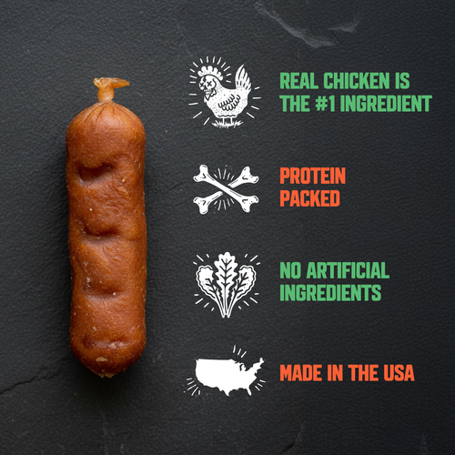 A single brown sausage or sausage-like food product stands upright on a dark textured background, next to four promotional graphics and text about chicken, protein, no artificial ingredients, and Made in the USA.
